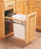 Trash container mounted in a kitchen cabinet