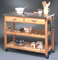 Portable kitchen island with countertop for work, drawers for utensils, shelves and towel racks