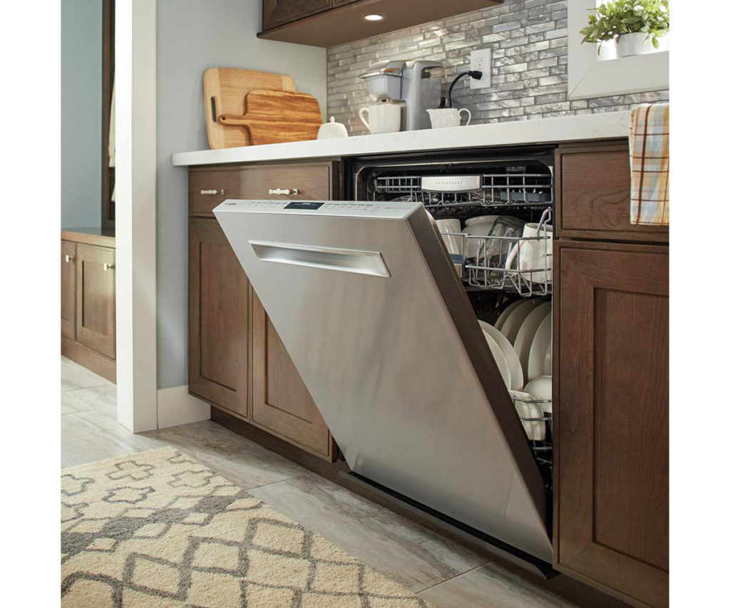 An opened dishwasher with clean dishes waiting to be emptied.