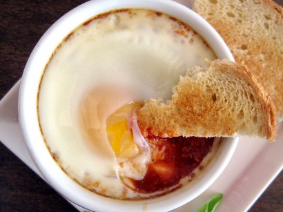 Baked Eggs in Spicy Tomato Sauce with Goat Cheese and Toast